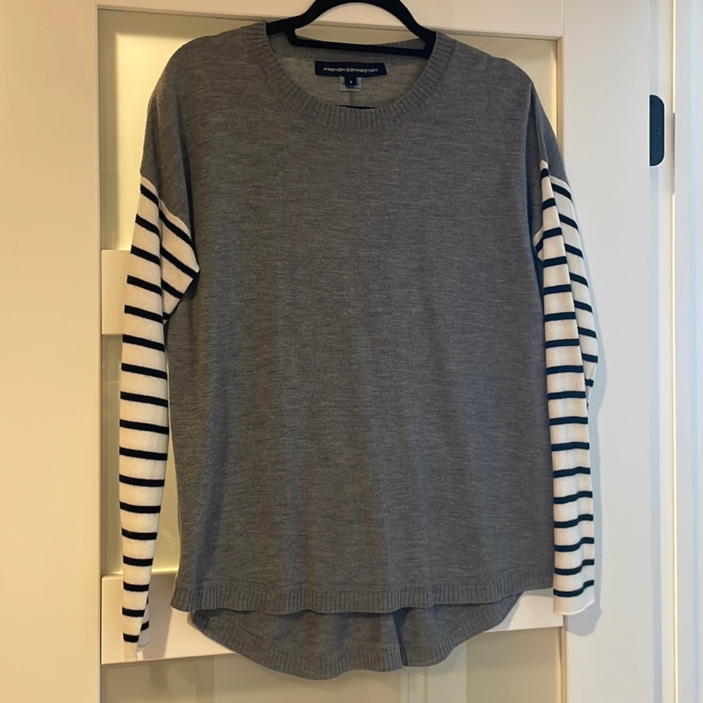 Gray sweater with striped sleeves